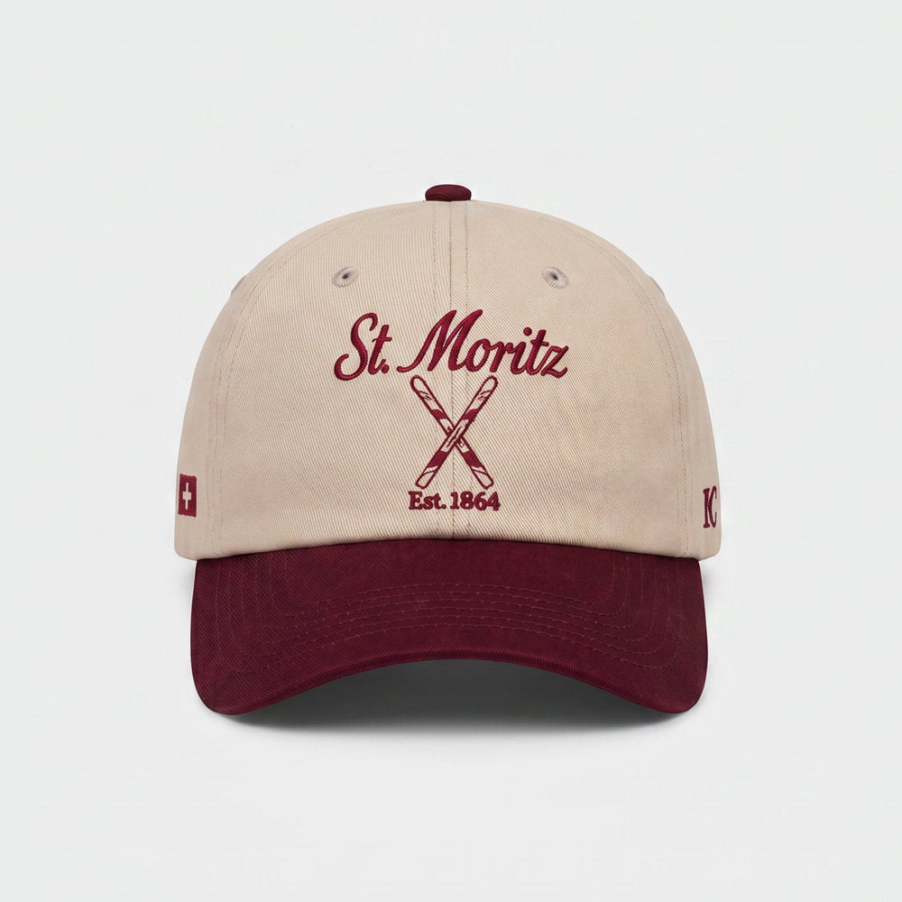 Beige and maroon cap with 'St. Moritz' text on a white background